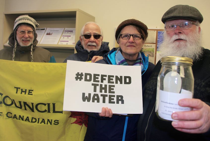 A sample of west coast water was delivered to MP Bill Casey’s office Friday, by a group of people including, from left, Brian Gaulkie, Wilf Bean, Lydia Jenkinson and Paul Jenkinson.  Deliveries were made to MPs’ offices across the country to bring awareness to concerns about the Kinder Morgan pipeline expansion.