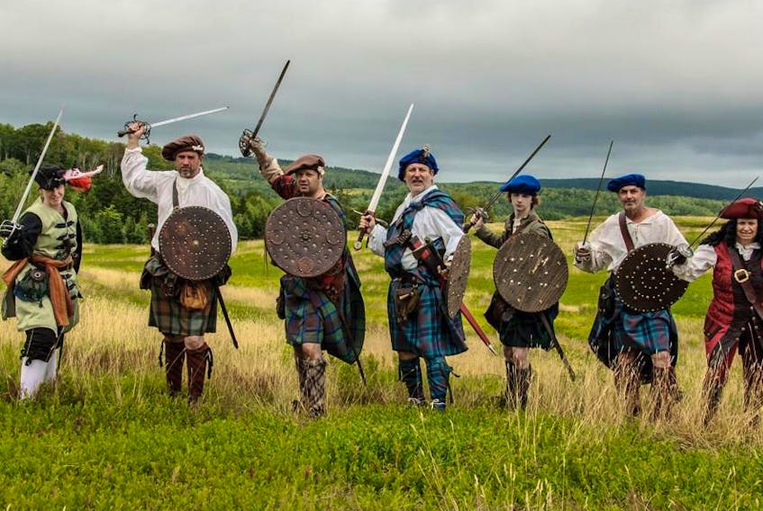 A few members of Gallus Gael prepare for battle. The re-enactment group brings the 18th century Scottish highlands to life.
Michael Stack photo