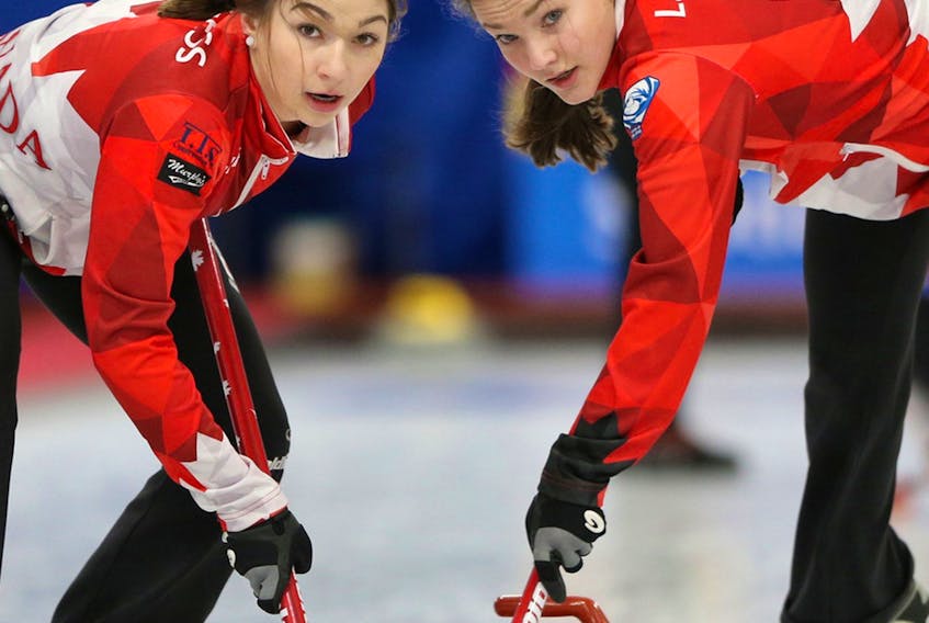 Truro cousins Karlee, left, and Lindsey Burgess, shown during the world junior curling championship in 2018, will compete at the New Holland Canadian junior championships in Langley, B.C., beginning on Saturday. Karlee Burgess, who plays third for Manitoba this year, can make history by becoming the first female player to win three championships. Lindsey Burgess is the third for Nova Scotia’s Taylour Stevens rink. Contributed