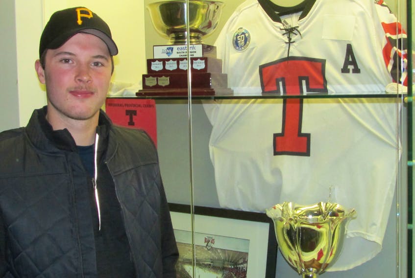 Truro Bearcats Noah Archibald stands near the Rath-Eastlink Community Centre showcase, which displays the team’s silverware from last season.
SUBMITTED PHOTO