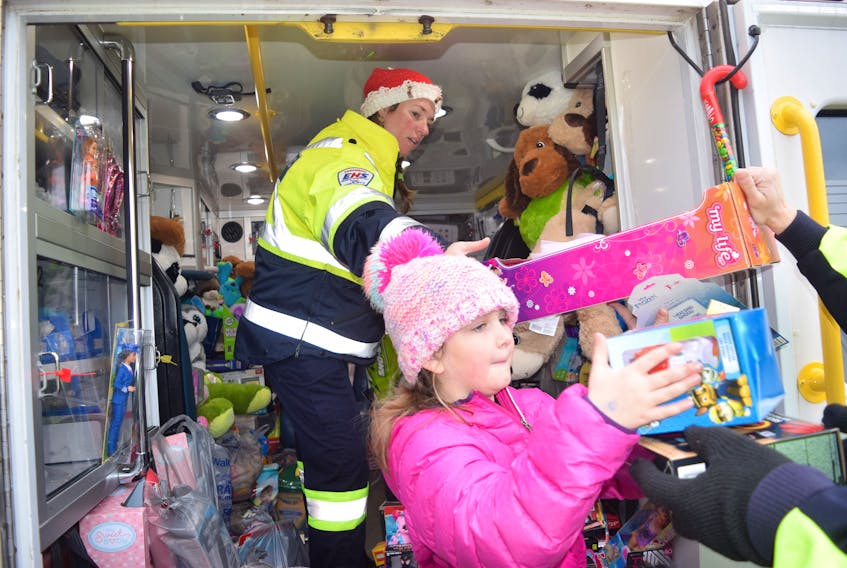 Paramedic Amanda Giles-Malloy was one of several paramedics in Truro loading up an ambulance with donated toys, gifts and sweet treats – with a little help from youngster Sophie Wells. The paramedics collected gifts for low-income children and families in front of the Truro Walmart on Dec. 1.