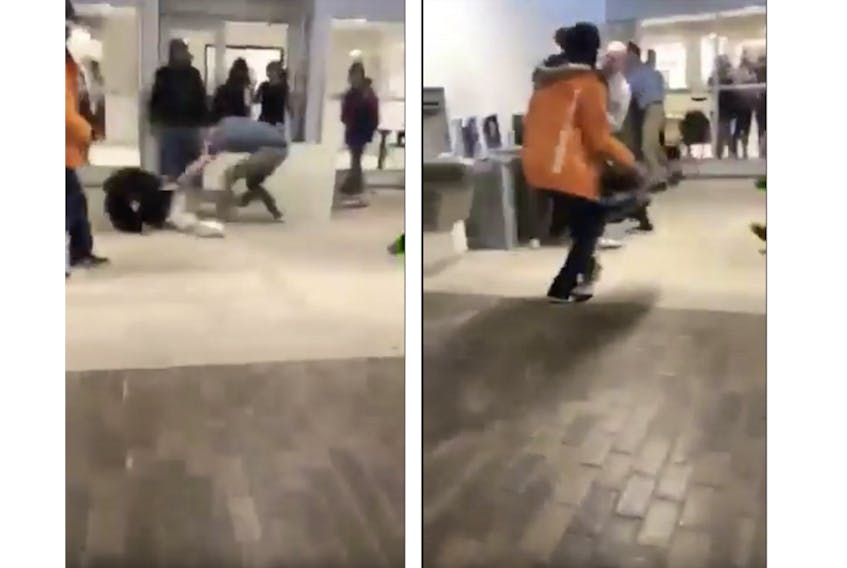 These images, taken from a YouTube video, show a fight in the hallway of Three Oaks Senior High School on Monday, Feb. 12, 2018. The image on the left shows students scuffling with one student on the floor, while the image on the right shows a staff member stepping in to break up the altercation.