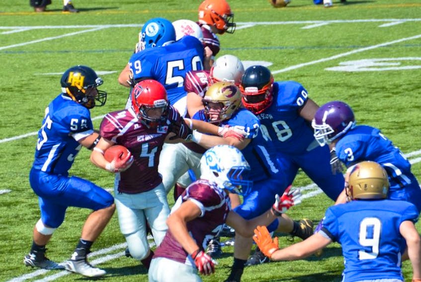 Aidan O’Neal of Sackville runs the ball for Team New Brunswick during last Thursday’s game against Team Nova Scotia at the Football Canada Cup in Saint-Jean-Sur-Richelieu, Quebec. Nine Tantramar Titan players were on the roster for this year’s New Brunswick U18 team. EMILY TOWER PHOTO