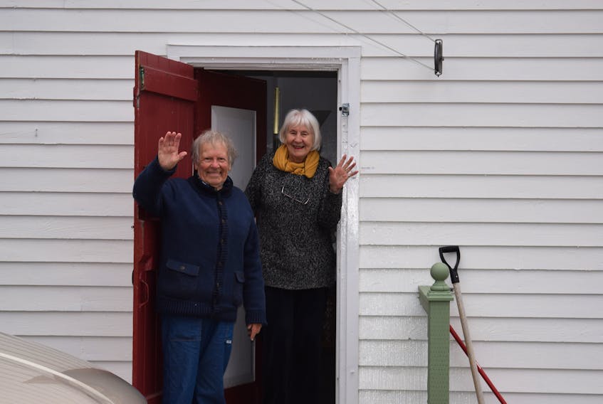Paul and Jan Zann of Truro wave a cheery hello from their back porch after recently returning from Spain, where they had difficulty leaving because of complications related to COVID-19. They are currently undergoing a 14-day quarantine.