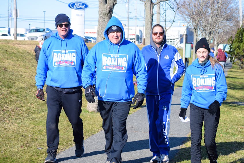 Beyond Boxing club members braved freezing winds to complete their sponsored walk. From left: Jonathan McGee, Ted Ash, Logan Paul and Danica McGee.