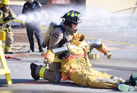 This firefighter dragged a life-sized dummy down Forrester Street in Truro during the Walk in Our Boots day on Sept. 21.