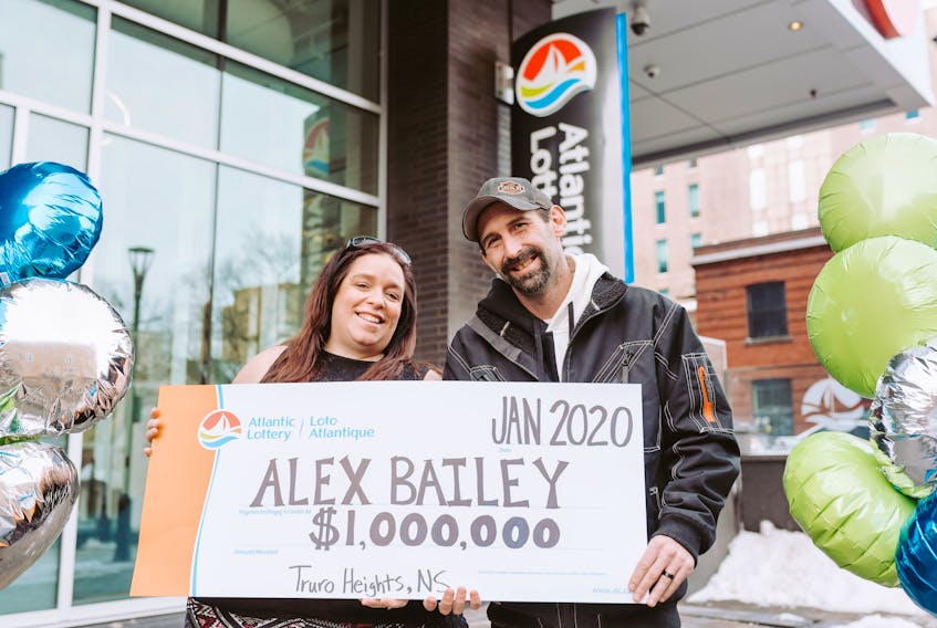 Angela Bailey, left, and her husband Alex were presented with a cheque for $1 million in Halifax after buying the winning Twist lottery ticket CONTRIBUTED PHOTO