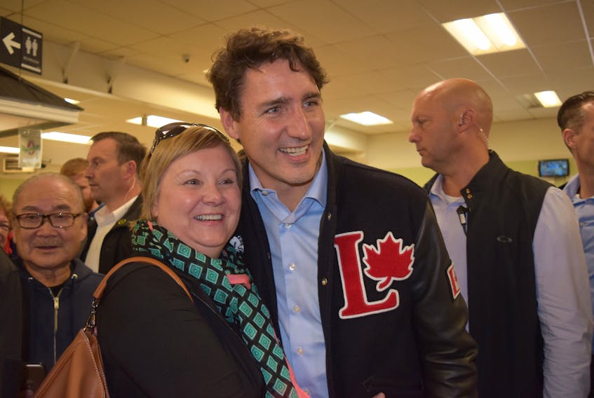 Karen Mombourquette of Bible Hill was happy to have her picture taken with Liberal leader Justin Trudeau during a quick stop on Tuesday at Masstown Market.