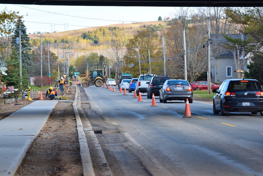 Motorists can expect delays along Highway 311 until at least late November as crews work to complete a sidewalk construction.
