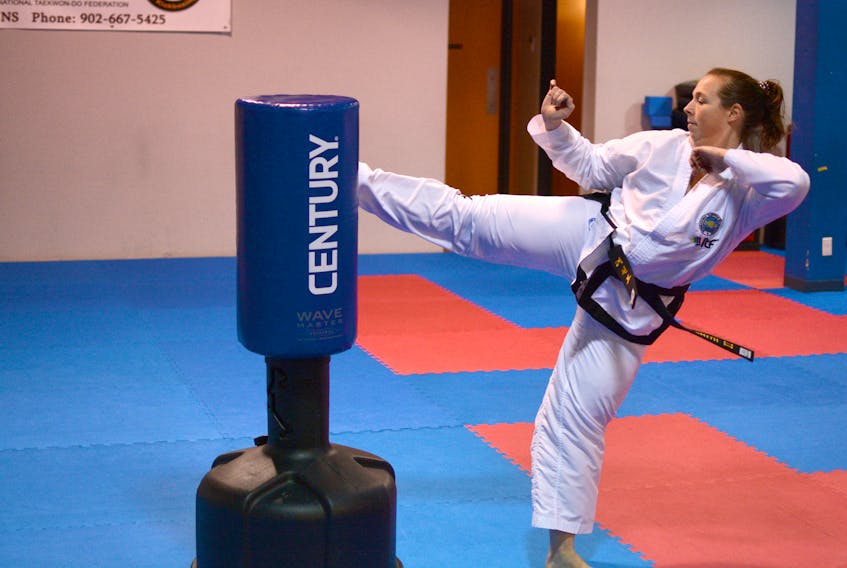 Susan Smith takes extra taekwondo classes and works out at the gym in preparation for the world taekwondo championships in Germany in late April.