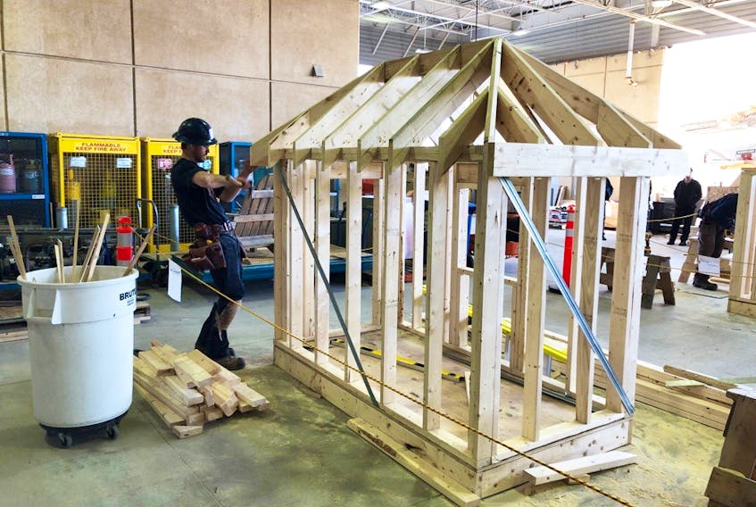 Pomquet’s Tanner Doiron in the midst of building his play house at the Nova Scotia Skills Competition, held in Halifax April 5. Doiron won gold at the event and will now compete in the nationals, also in Halifax, later this month.