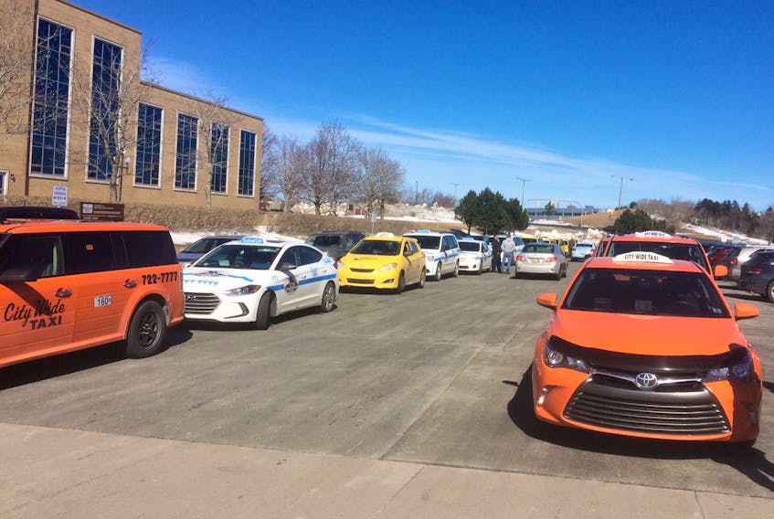 Taxi cabs hold protest at Confederation Building. Taxi owners want the provincial government to bring in measures to help reduce their insurance costs that many say will put them out of business if more help is not forthcoming.