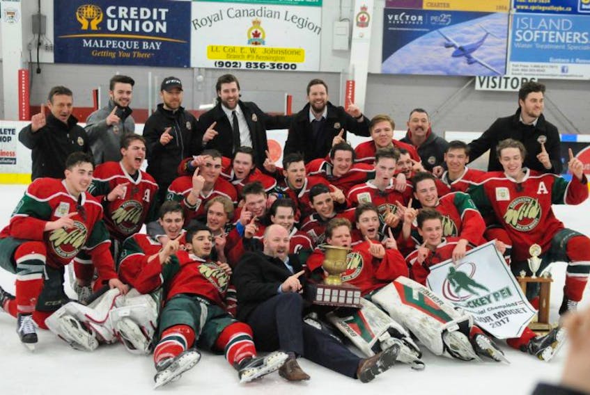 The Kensington Monaghan Farms Wild pose for the traditional team photo at centre ice. The Wild defeated the Charlottetown Bulk Carriers Pride 6-1 in Game 7 of the best-of-seven provincial major midget hockey championship series before a full house at Community Gardens in Kensington on Saturday night.