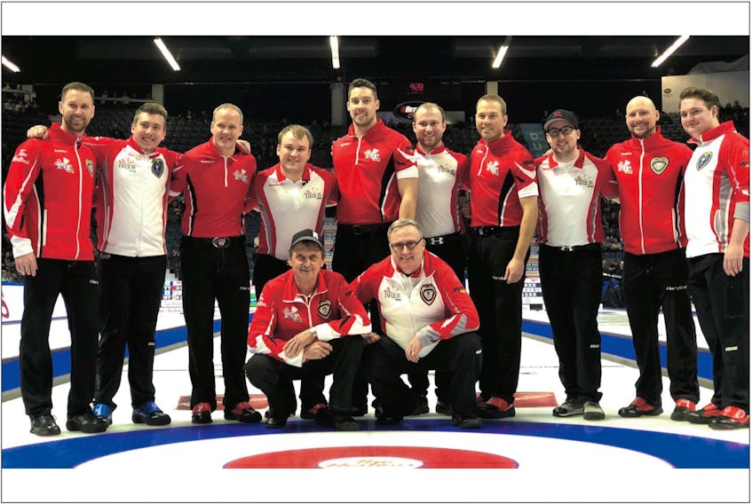 Here’s a Newfoundland and Labrador curling photo unlike any other. Brad Gushue and defending champion Team Canada pose with members of the Newfoundland and Labrador entry skipped by Greg Smith after their preliminary-round game Wednesday in Regina. Both rinks are based out of St. John’s. Team Canada won the game 7-2 and has advanced to the championship pool at the Brier. Smith and his Newfoundland rink did not make it to the next round, but have a placement game against Prince Edward Island this morning. Shown standing in the picture are (from left), Gushue, Smith, Team Canada third Mark Nichols, Team N.L. third Matthew Hunt, Team Canada second Brett Gallant, Team N.L. second Andrew Taylor, Team Canada lead Geoff Walker, Team N.L. lead Ian Withycombe, Team Canada spare Tom Sallows and Team N.L. spare Connor Stapleton. In front are Team Canada coach Jules Owchar and Team N.L. coach Joe Murphy. — Curling Canada photo/Michael Burns