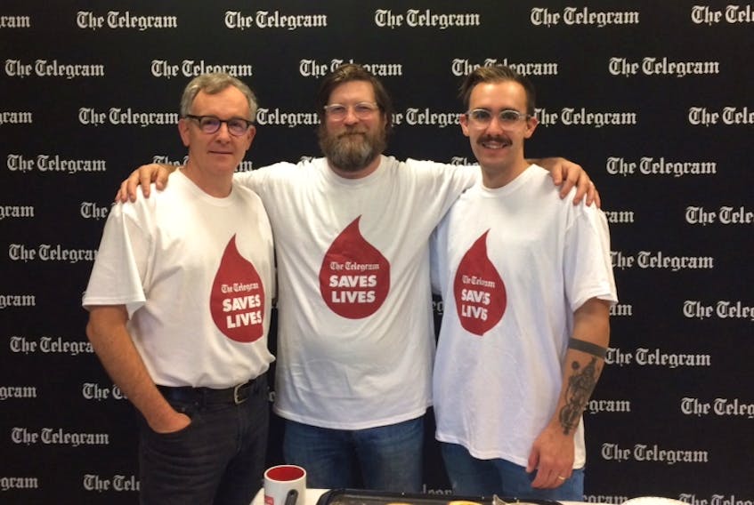 The Telegram's Gerry Carew with chefs Jeremy Charles and Ross Larkin. The chefs made pancakes at Canadian Blood Services Friday as part of the annual Telegram Saves Lives blood drive. Submitted photo.