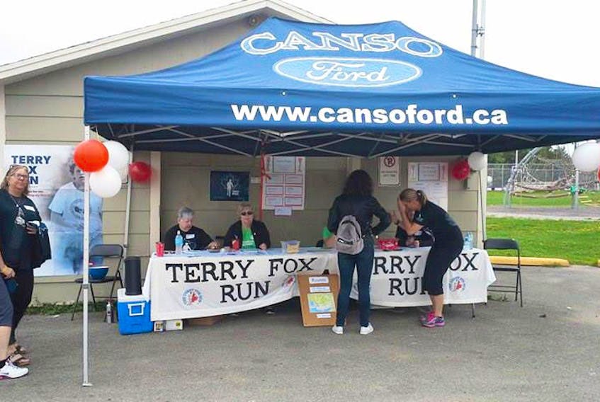 Volunteers help people register during a past Port Hawkesbury Terry Fox Run.