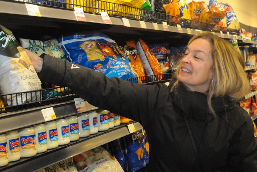 Jackie Hyde of St. John's stocks up on storm chips Wednesday in a local supermarket in anticipation of the snowstorm forecast for Friday. Joe Gibbons/The Telegram