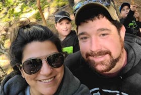 Tim Amero, a third-generation forest worker and owner of Cut Rite Logging in New Edinburgh, poses with his girlfriend, Denise Tardif, and her two boys, Marcien and Miguel.