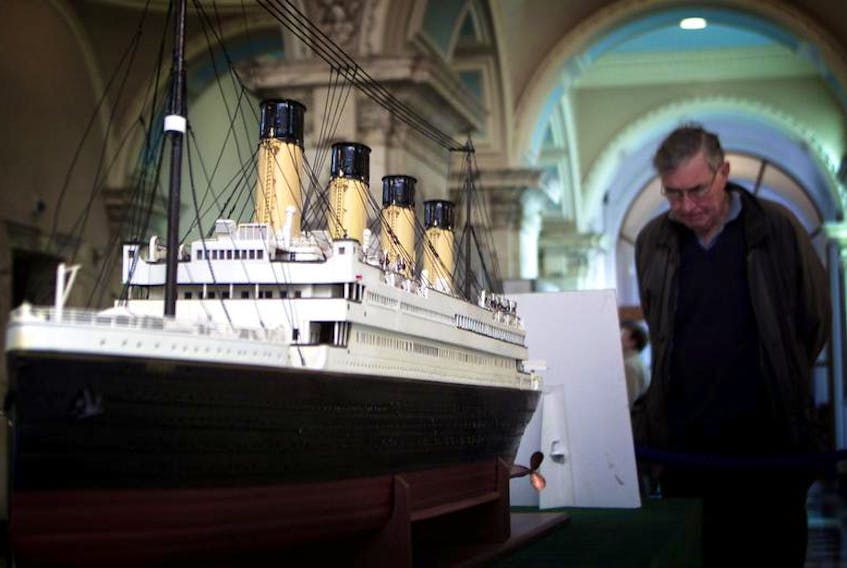 A visitor looks at a model of the RMS Titanic during an exhibition at Belfast’s City Hall in 2002. Harland and Wolff, the Belfast shipyard that built the Titanic, has been put into administration.