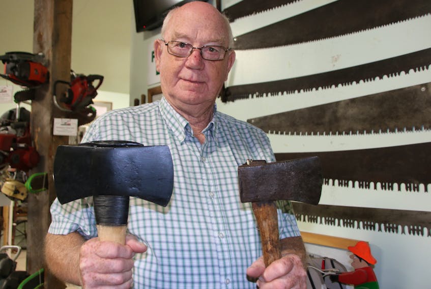 Page Baird is a member of the Atlantic Tool Collectors, as well as a volunteer with the Farm Equipment Museum. The axes he’s holding were made by Blenkhorn’s Axe Factory, which operated in Canning from 1846-1962.