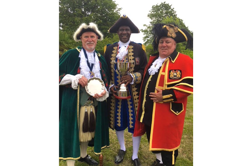 Jim Stewart, left, is pictured with Ed Christopher of Hamilton, Bermuda and host crier David Hinde of Helmsley, East Yorkshire at The Magna Carta Cup. Stewart placed second behind Christopher.