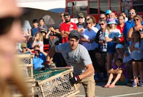 North Port lobster fisherman Lucas Murphy hauls a 95-pound lobster trap during the Journal Pioneer Lobster Trap Stacking Competition on Thursday evening.