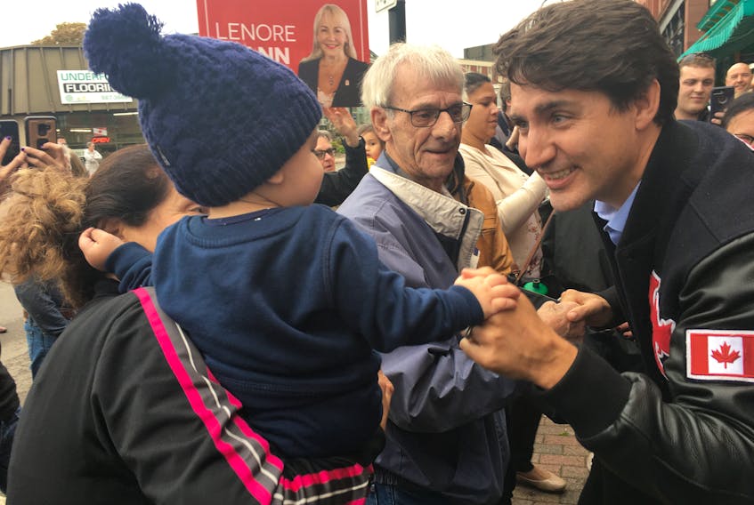 Prime Minister Justin Trudeau says hello to a young Amherst resident during a whistle stop in the town on Tuesday. The prime minister made a quick stop in the community on his way to a rally in Halifax.