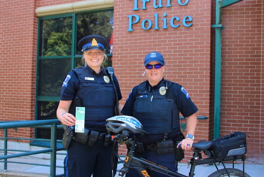 Truro Police Constables Katie Titus and Kelly Quinn are out on foot and bike patrols around Truro this summer. Titus is handing out the positive tickets to children for good behaviour again this year.