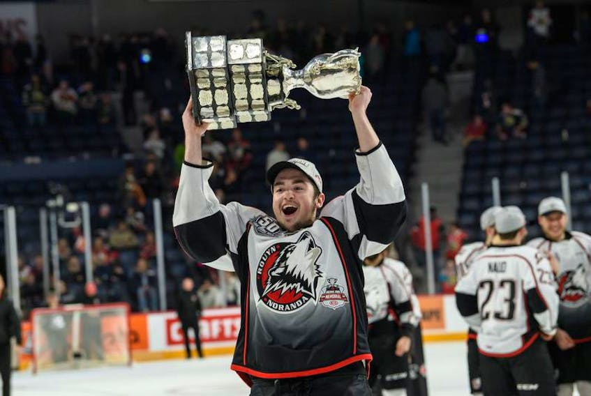 Cole Harbour’s Tyler Hinam raises the Memorial Cup at the Scotiabank Centre on Sunday after the Rouyn-Noranda Huskies beat the Halifax Mooseheads 4-2 in the championship game.