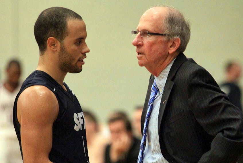 St. F.X. X-Men head coach Steve Konchalski and former guard Tyrell Vernon go over strategy during an Atlantic University Sport (AUS) game. Vernon has been named associate coach for the program. He will take over for Konchalski as head coach after the 2021 season. Herald file