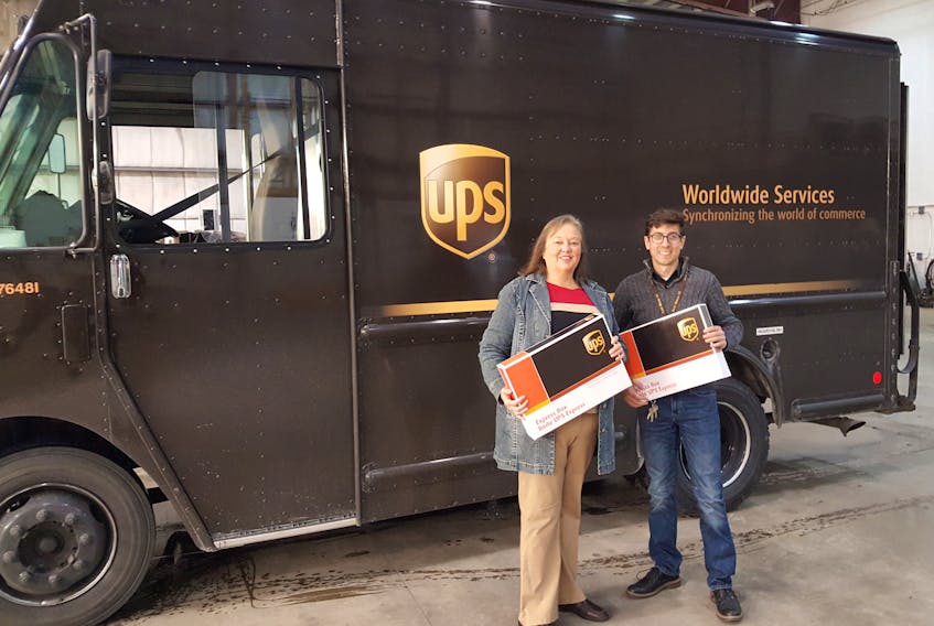 Empower’s executive director Kimberly Yetman Dawson (left) and UPS business supervisor Jan Cantin are getting ready for the Telegram/UPS Take Two Oct. 20 donation drive.