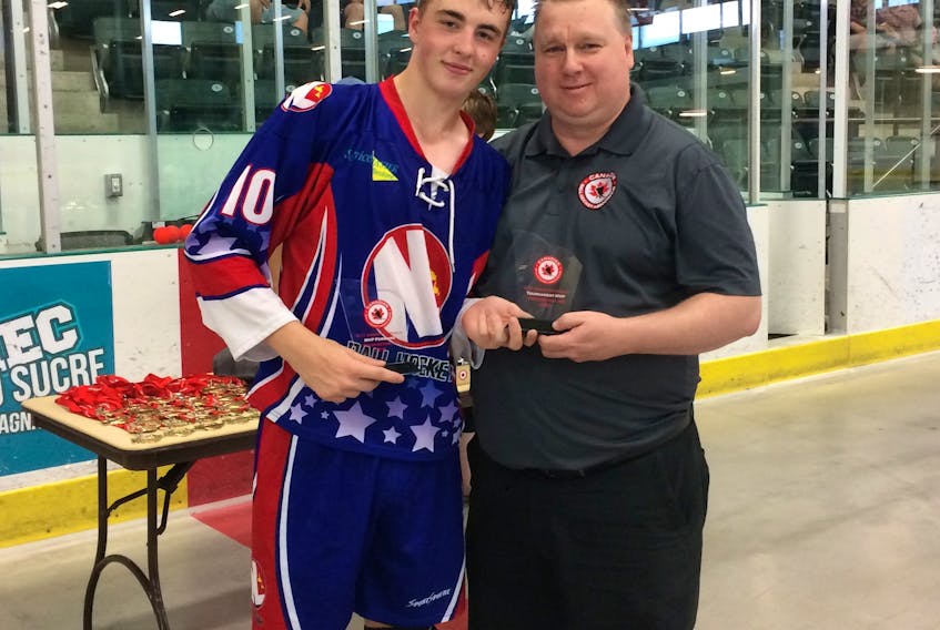 Mark Hillier receives his individual awards after helping Team NL to a 5-3 victory over British Columbia in the gold-medal game at the 2018 national Under-17 male ball hockey tournament Sunday in Fredericton, N. B.