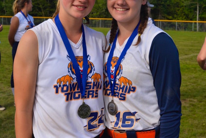 Andrea Caron, left, and Ally Hustler were presented with major awards at the Eastern Canadian under-16 girls softball championship in Cole Harbour, N.S., on Sunday. Caron was named the tournament’s most outstanding pitcher while Hustler received the award for most outstanding hitter.