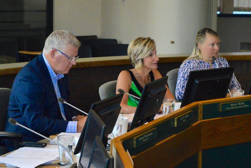 CBRM Mayor Cecil Clarke, chief administrative officer Marie Walsh and citizen appointee Carmen Dunn listen to Tuesday’s presentation of a draft report of a provincially-funded study into the viability of the municipality at the civic centre in Sydney before the CBRM's viability study steering committee. The preliminary findings of the $224,000 study show that the CBRM’s declining population poses a major obstacle to efforts aimed at reviving the cash-strapped municipality’s struggling economy.