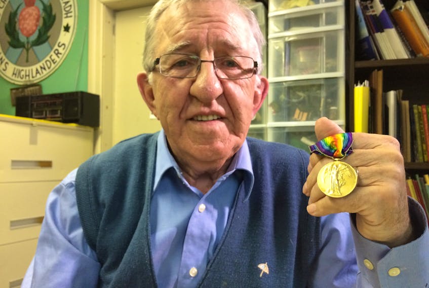 Ray Coulson, curator of the North Nova Scotia Highlanders Regimental Museum in Amherst, holds up a First World War Victory Medal belonging to Pte. R.C. McDonald of the 25th Battalion of the Canadian Infantry. He’s helping a retired Canadian Navy commander in his efforts to locate McDonald’s descendants.