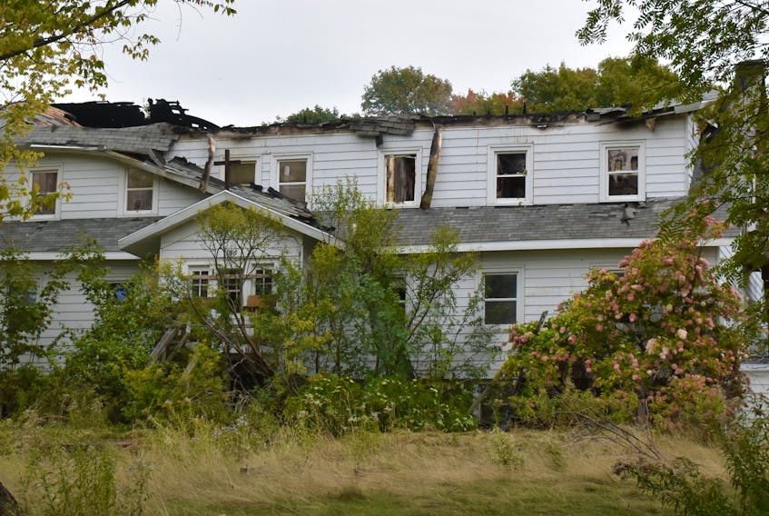 This photograph of the former Villa Madonna Retreat House in Little Bras d'Or shows the damages the structure incurred during an overnight fire that started late Saturday evening. As the overgrown bushes indicate, the building was vacant at the time of the blaze that had firefighters from three departments busy until Sunday morning.