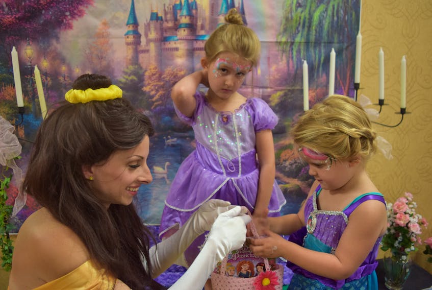 Jessi Puddifant as Belle (left) hangs out with Ayla White as Disney Princess Sophia and her sister Scarlet (L) as Ariel from the Little Mermaid.