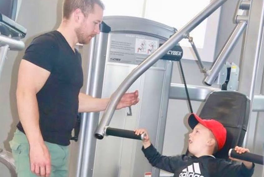 Adam Boyle enjoys sharing his love of working out with his six-year-old son Chase. Boyle and his wife Stacey Burton own Flex Fitness in Deer Lake.