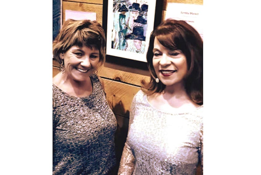 Kathy Spears, who is unemployed because of health reasons but still paints, is one of the artists who had art work on display at the Tearmann Society’s 25th annual Celebration of Art which was held on Friday, May 3. She is pictured here with the emcee of the event, Saltwire meteorologist Cindy Day.