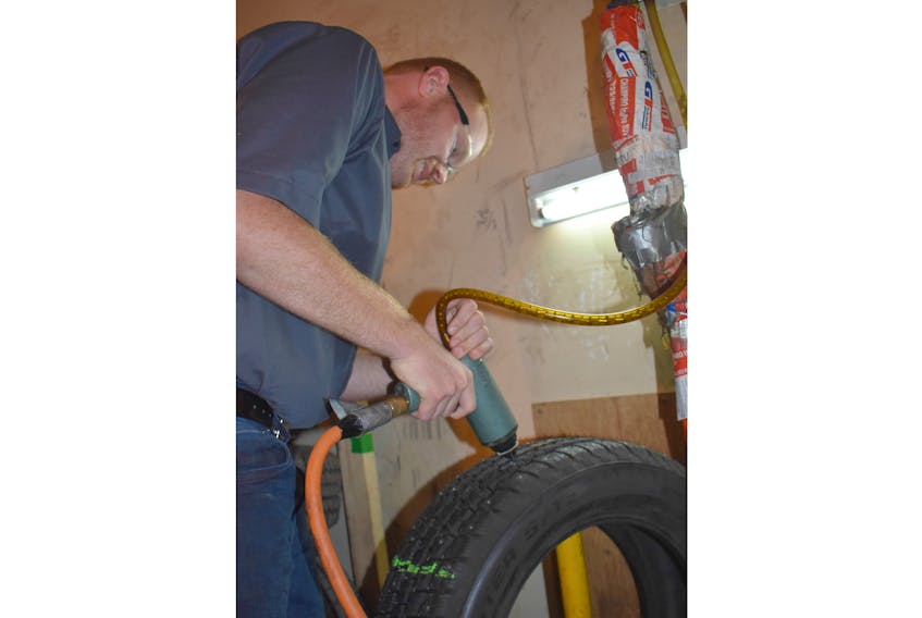 Mitch Gammon has already begun studding tires at his business OK Tires on Westville Road. He purchased the business in February.