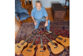Rick Whitaker shows a guitar in progress at his home in Limerock, Pictou County.