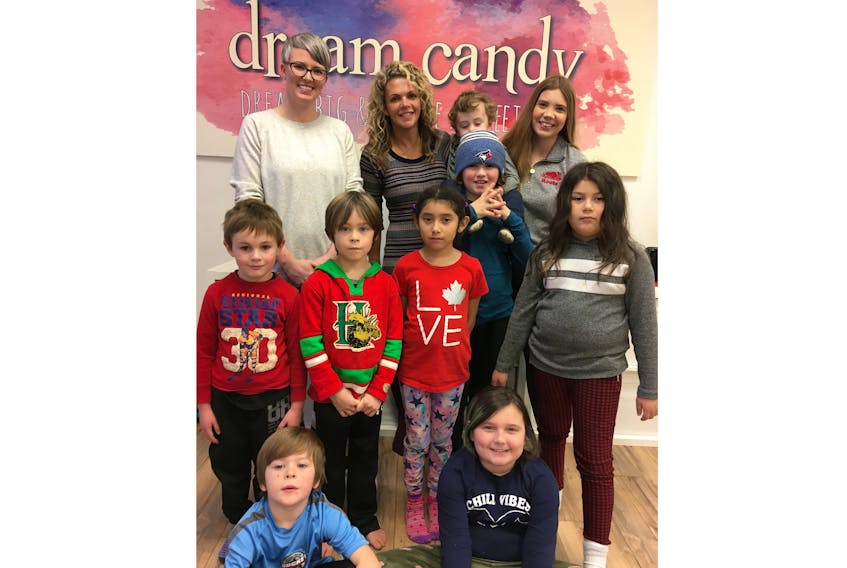 Dream Candy co-founders Deelle Hines and Camilla MacDonald, in the background from left, with some of their after school program participants. Information on specific Dream Candy programs is available on its Facebook site.