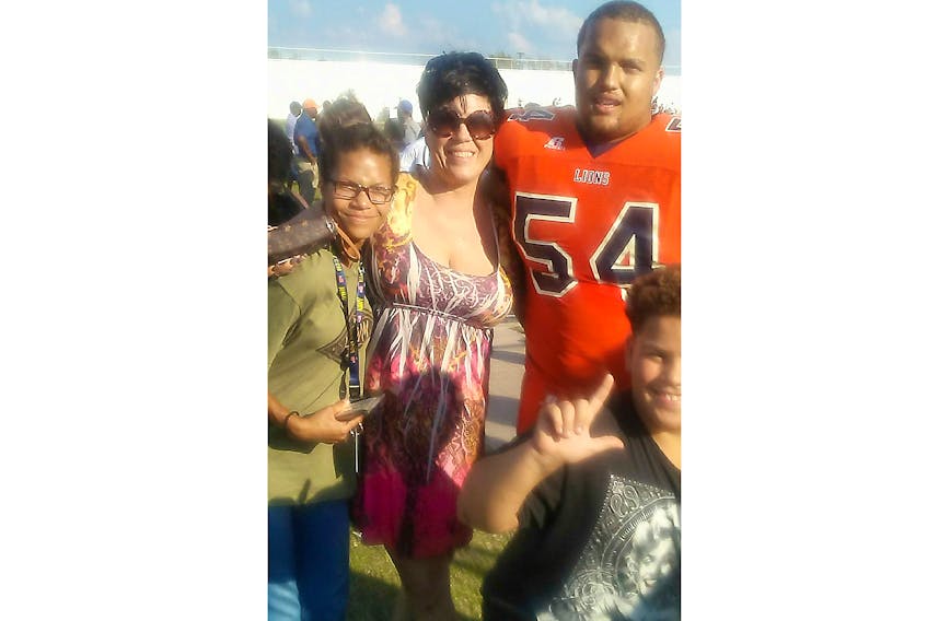 Born in Pictou County and raised in football-crazy Oklahoma, Juwan Vint now helps anchor the Saint Mary’s Huskies defensive line. He is shown here with his mom Denise, and siblings Olivia and D.J.