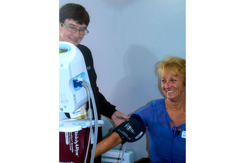 Darlene MacNeil, director of safety, environment and infrastructure, is shown having her blood pressure tested by RN Nina Clarke at the recent Glen Haven Manor Health & Wellness Fair for staff.