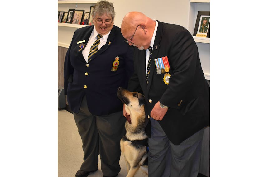 Trenton Legion President Heidi Boyles said they were happy to be able to help with the process of getting a service dog for Ron Wray. They are pictured here with Milo, a German Shepherd that has been trained to help Wray with PTSD, mobility and to remind him when his blood sugar is low.