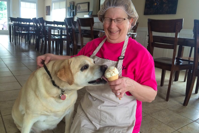 Beverly Whidden gives Abbie an ice cream treat at Molly's Dairy Bar.