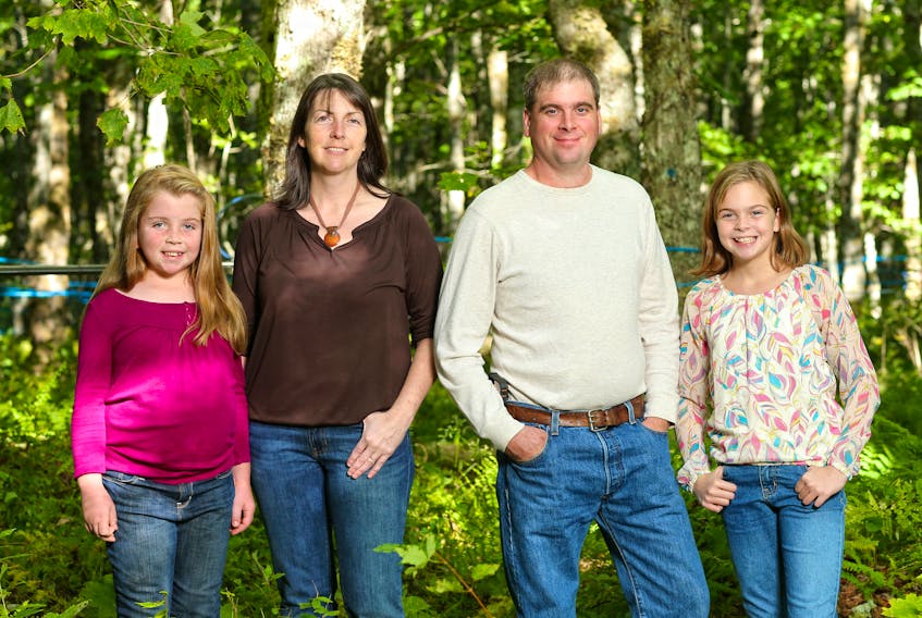 Agricultural college alumni Jason and Nicole Haverkort and their girls, Jessica, left, and Juliana at Haveracres Maple Farm in Antigonish. The family maple syrup business sells their products in many communities, including Truro.