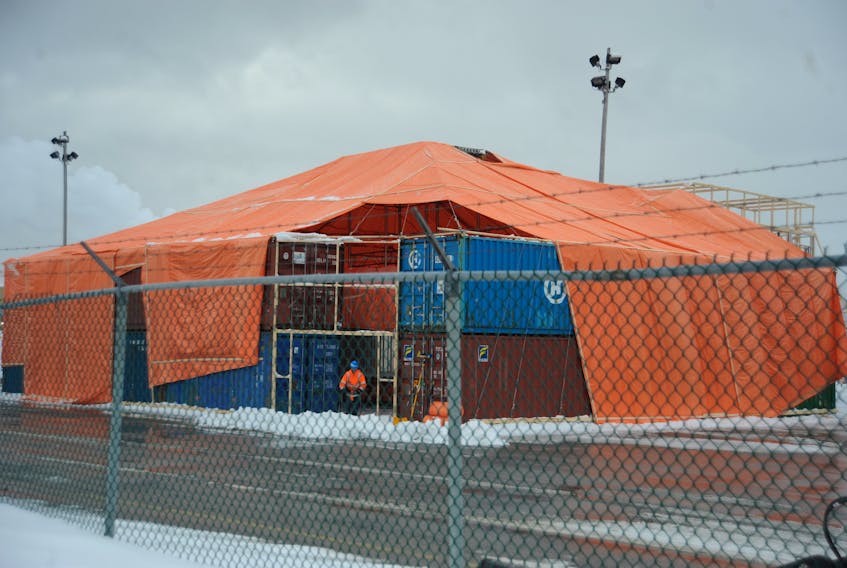 Workers have been building a temporary structure around the subsea cable turntable at the port of Corner Brook in anticipation of the arrival of cable later this month.