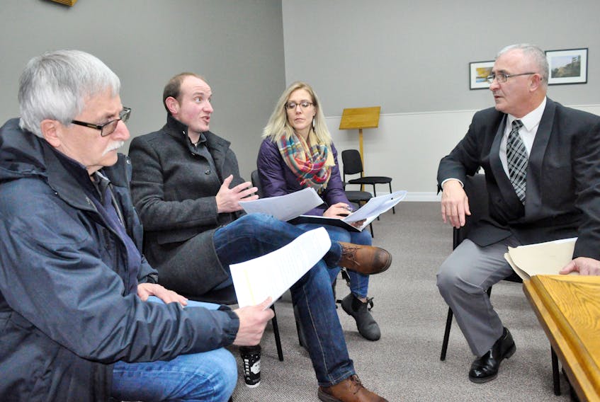 After bringing down the Town of Stephenville 2019 budget, Coun. Mark Felix, right, chair of the finance committee, is seen discussing aspects of it with economic development representatives who were on hand from left: Bob Byrnes, businessman; Scott Locke, assistant director of Economic Development and Community Partnerships; and Candace Simon, director of the same agency.