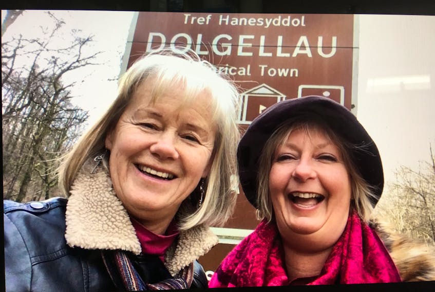 Linda Goodyear, a St. John’s dentist originally from Corner Brook, and her friend Brenda Lee of Corner Brook, filmed a travel reality show “Broads Abroad” in February. They are seen here in front of the sign for Dolgellau in Wales.